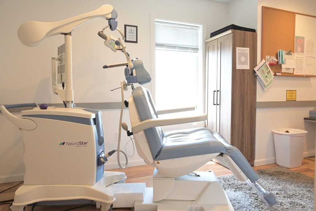 side view of a transcranial magnetic stimulation or tms therapy chair in a mental health treatment center