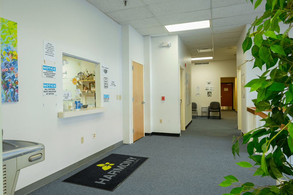 view of the lobby and front desk window at the harmony location in wheeling