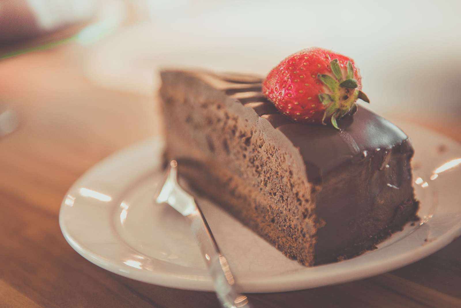Chocolate cake slice with strawberry on top