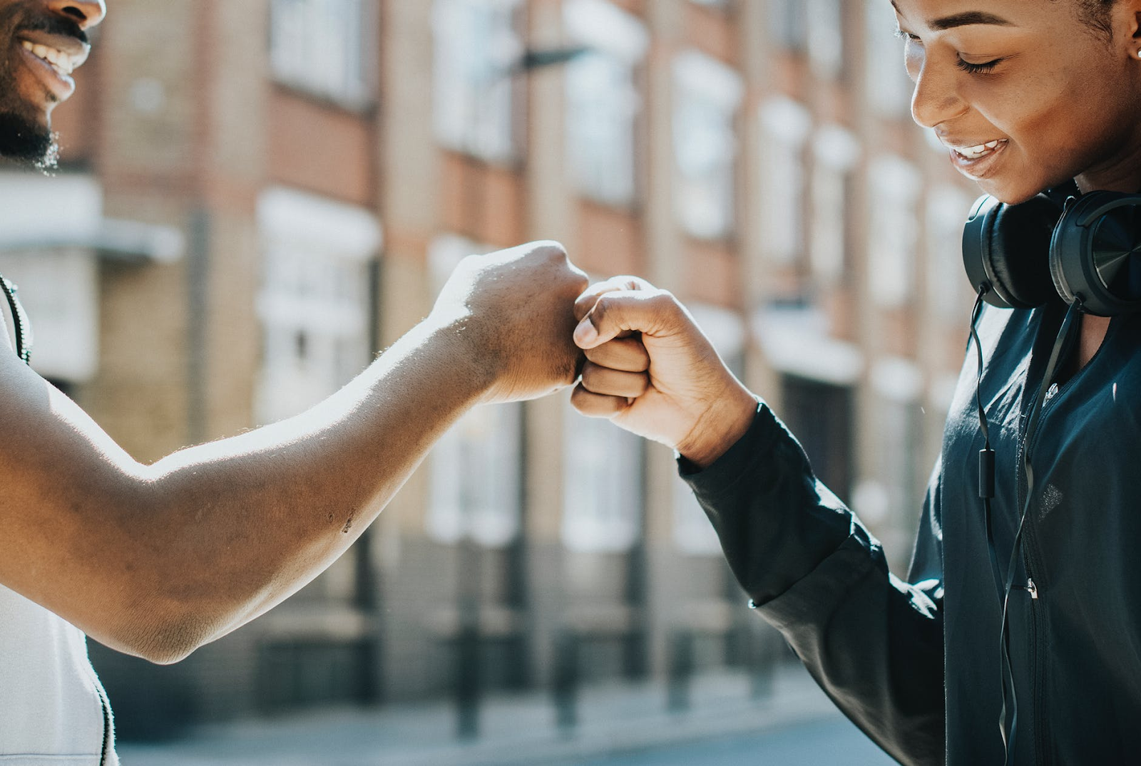 fist bump between a woman and a man