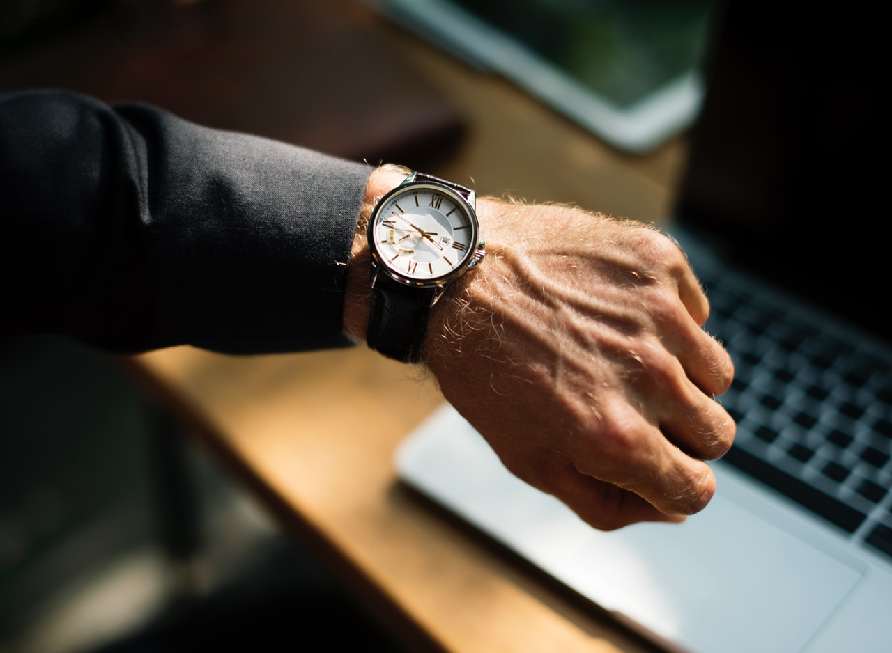 A man's arm with a wristwatch on it