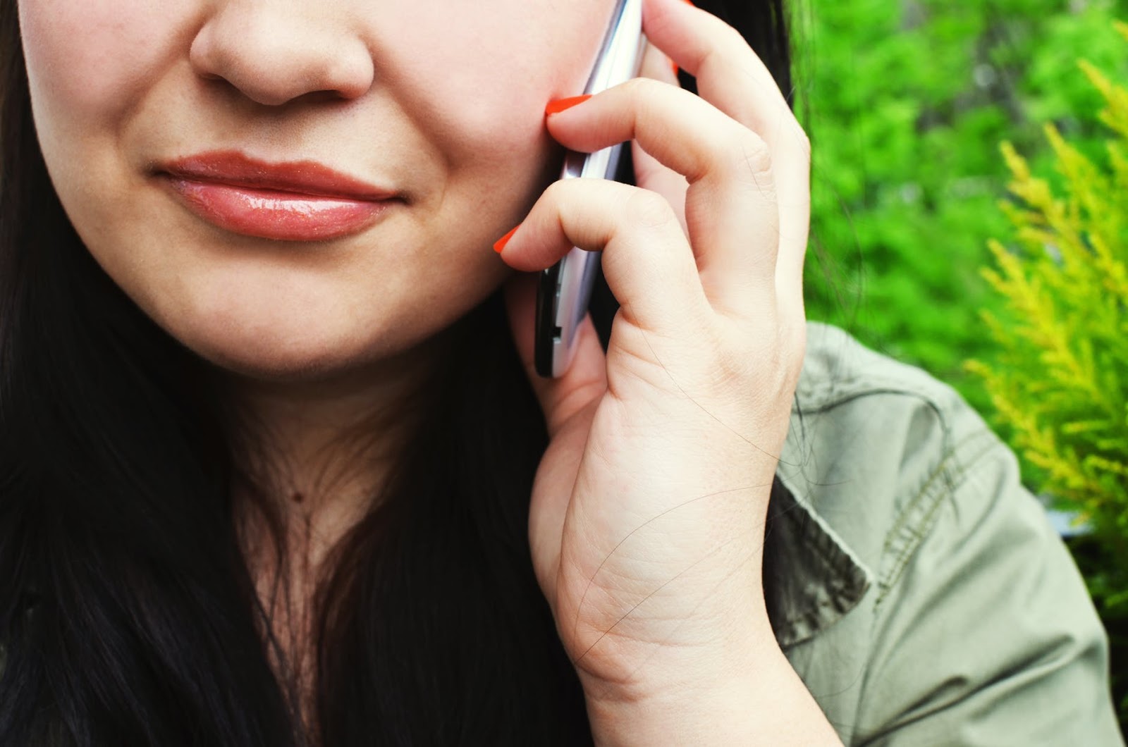 A woman is on the phone, reaching out to someone for emotional support.