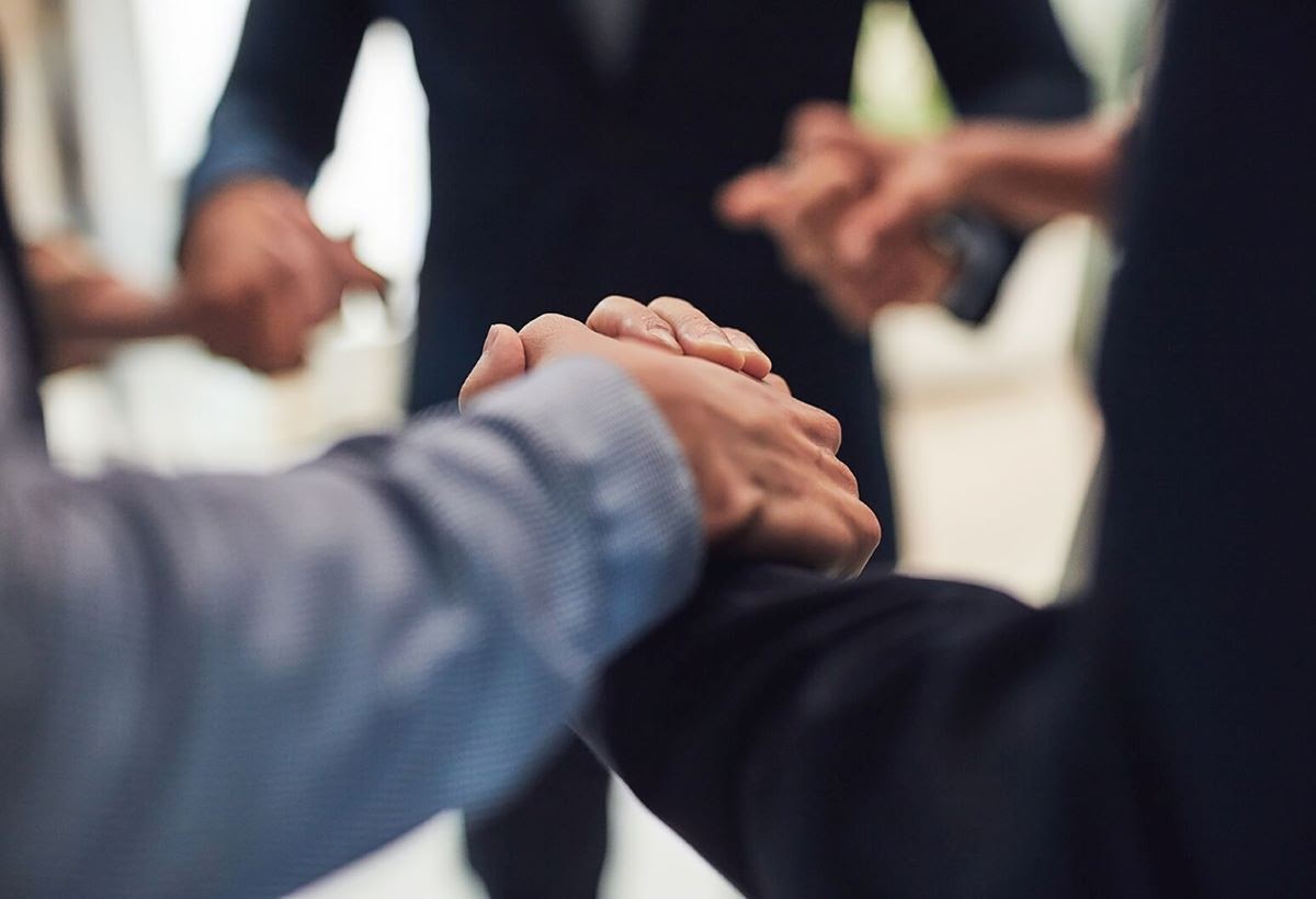 A group of people holding hands