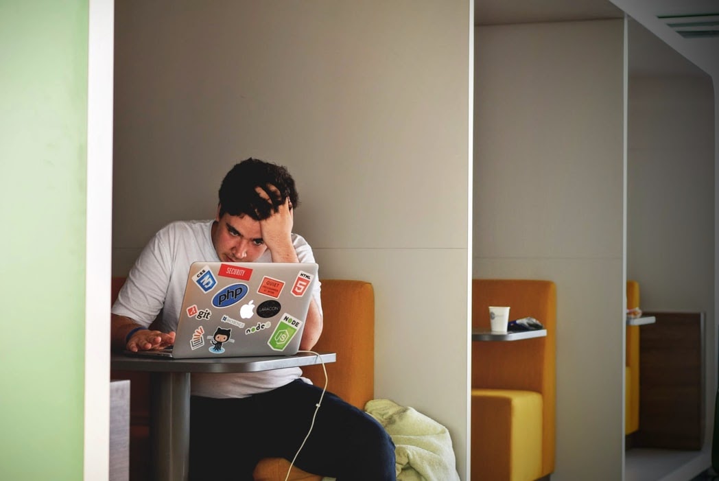 A stressed man looking at this laptop. 