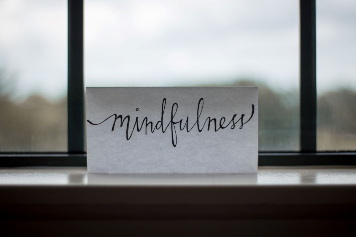 A Note Reading Mindfulness in Front of a Window