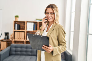 A woman on the phone at a mental healthcare practice