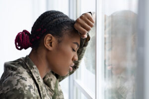 A female veteran thinking about recovering from PTSD