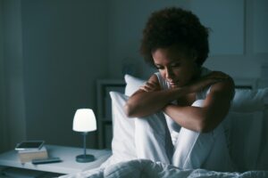 A woman experiencing signs of anxiety