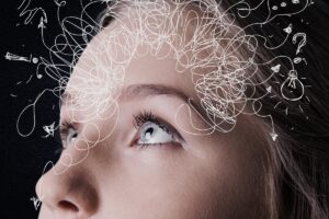 A woman thinking about intrusive thoughts and OCD