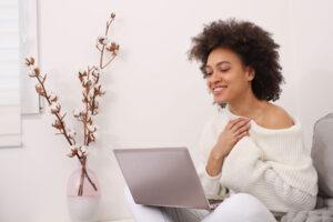 A woman reading about teletherapy