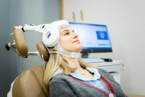 A woman undergoing TMS therapy for depression