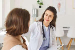 woman talks with clinician about choosing a therapist for anxiety