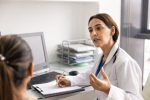 clinician talking with patient about tms treatment